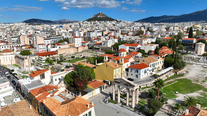 Obraz premium Aerial drone photo of iconic Roman Market featuring tower of Winds and Gate of Athena in the heart of Athens historic centre built in Plaka district, below Acropolis hill, Attica, Greece