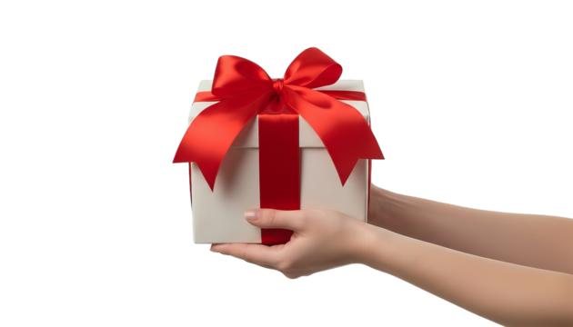 A person holding a white gift box tied with a red satin ribbon, present against a dark backdrop. - Powered by Adobe