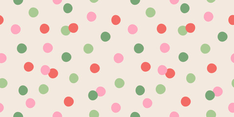 Christmas confetti vector seamless pattern. Colorful pastel confetti trendy background. Polka dots print in pink, green, red colors on Xmas, birthday, party. Holiday wrapping paper.