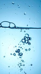 Bubbles rising through crystal-clear blue water