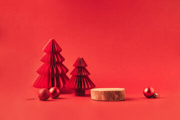 Festive Christmas podium for product display and advertising campaigns. Minimalistic red background