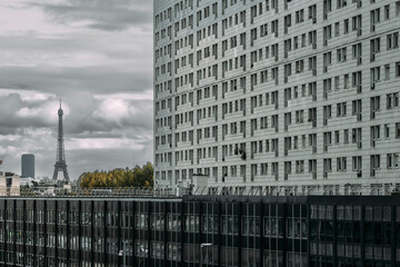 Aerial view over urban city skyline with residential apartments and modern office architecture buildings in Paris under diffuse daylight