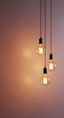 Vintage Edison Style Filament Light Bulbs Hanging with Warm Glow on Textured Background, Concept for Creativity, Idea, Energy, and Interior Design