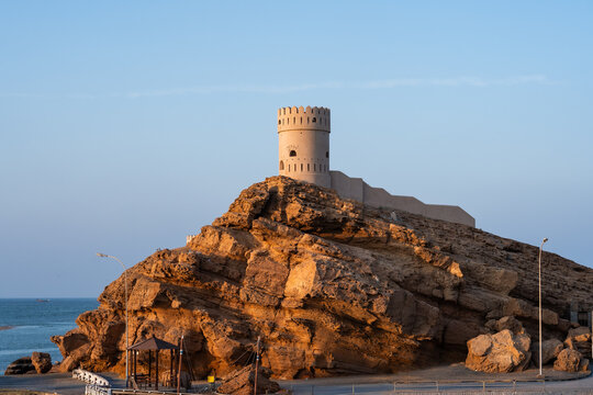 Sur watchtower on coastal rock enjoying sunset light
