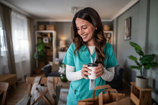 Nurse receiving takeaway food for a relaxing break