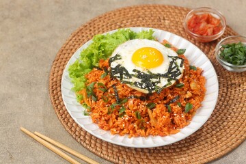 Kimchi bokkeumbap (kimchi fried rice) is a Korean dish consisting of rice fried with kimchi.