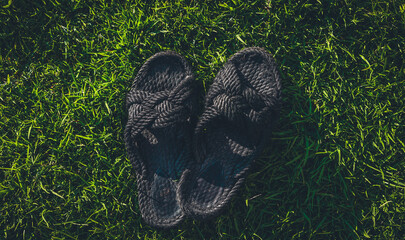 Black Shoes Flip Flops on Green Grass Beach Summer Footwear Relaxation
