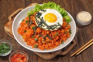 Kimchi bokkeumbap (kimchi fried rice) is a Korean dish consisting of rice fried with kimchi.