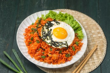 Kimchi bokkeumbap (kimchi fried rice) is a Korean dish consisting of rice fried with kimchi.