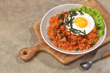 Kimchi bokkeumbap (kimchi fried rice) is a Korean dish consisting of rice fried with kimchi.