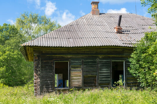 Ruins of an old abandoned wooden house in the countryside