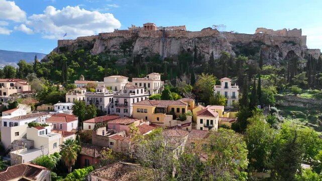 Aerial drone cinematic video of iconic Roman Market featuring tower of Winds and Gate of Athena in the heart of Athens historic centre built in Plaka district, below Acropolis hill, Attica, Greece
