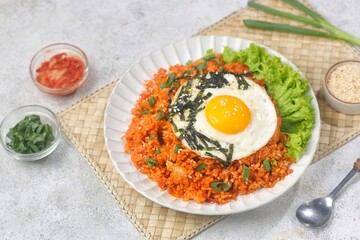 Kimchi bokkeumbap (kimchi fried rice) is a Korean dish consisting of rice fried with kimchi.
