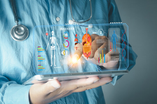 Healthcare and technology concept. Doctor's hand holding a tablet with a virtual medical interface showing human body, organs, and vital signs. Future of medicine, AI diagnostics, and science. - Powered by Adobe