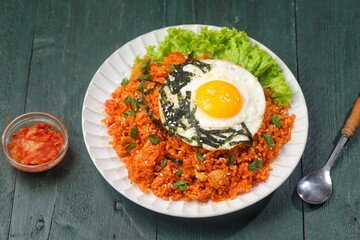 Kimchi bokkeumbap (kimchi fried rice) is a Korean dish consisting of rice fried with kimchi.