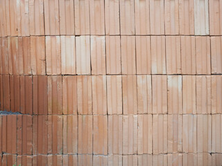 Red bricks for building in construction site for background.