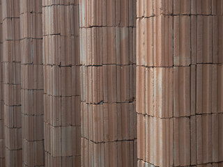 Red bricks for building in construction site for background.