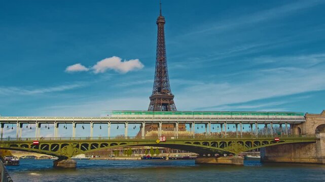 Paris, France - 26.08.2025 : A pedestrian bridge with metro line number 6 against the backdrop of the Eiffel Tower. The oldest green metro line, number 6 in Paris. Timelapse
