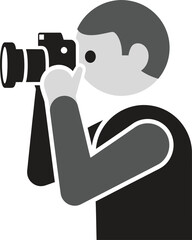 A photographer taking a picture with a camera, focusing on the subject to capture the perfect moment the photographer is dressed in casual attire