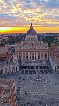  Aerial shot of the Vatican city state in Rome, Italy. Drone view of Saint Peter Basilica in Vatican State. Rome, Italy. A tourist attraction for all religious people