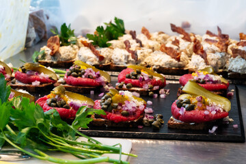 Smorrebrod on rye bread, open sandwich with tartare steak, ground beef.