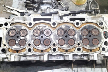 Part of car engine, four valve in head for each cylinder