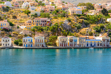 Idyllic seafront colorful houses on the island of Symi. Dodecanese, Greece