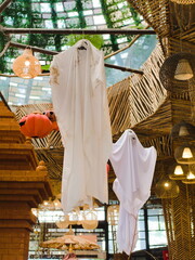 Ghost and Pumpkin Ornaments Inside Rustic Bamboo Restaurant