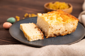 Сottage cheese Сasserole, Curd cake, with dried apricots and raisins on brown wooden, side view, selective focus
