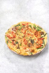Pajeon is a typical Korean savory pancake made from flour dough, spring onions, and various seafood.