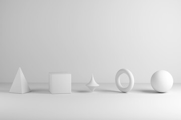 White geometric shapes on minimal studio background