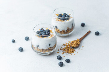 Yogurt granola parfaits topped with fresh blueberries