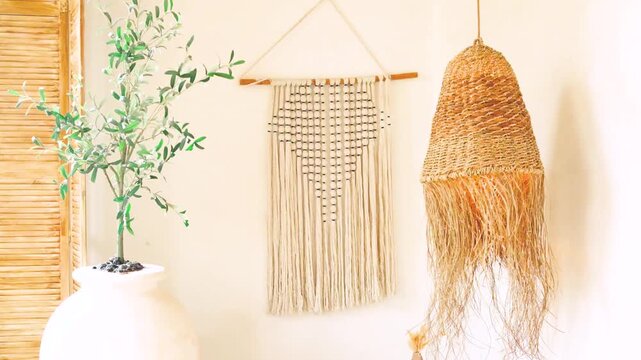 Bohemian style macrame wall hanging and natural woven pendant light decoration