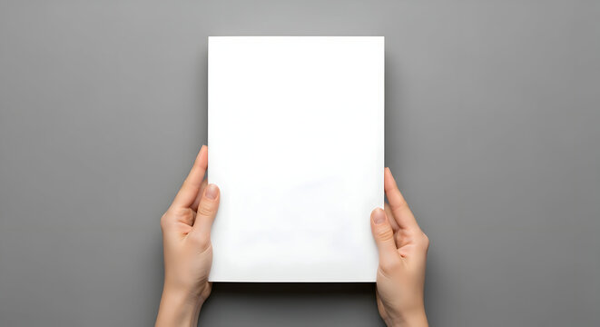 Elegant hands holding blank paper for vibrant designs, modern brochures, or professional presentations, perfect for captivating marketing and creative projects