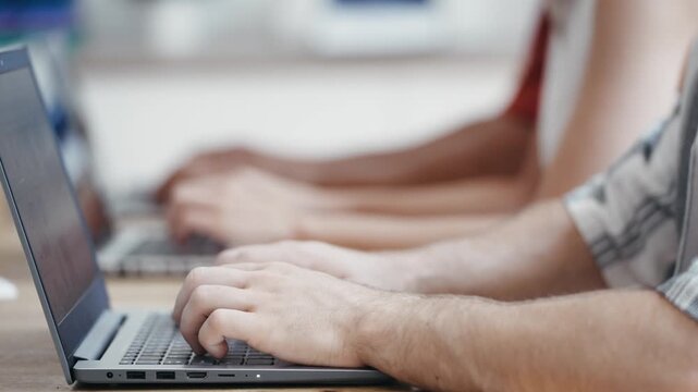 Video of close up of business team working with laptops on coworking place.