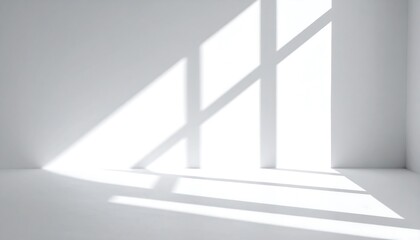 Minimalist white room with sunlight streaming through window.