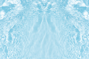 Blue water with ripples on the surface. Defocus blurred transparent blue colored clear calm water surface texture with splashes and bubbles. Water waves with shining pattern texture background.