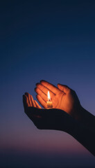 Pair of hands gently cradles small candle flame, symbolizing hope and warmth in twilight