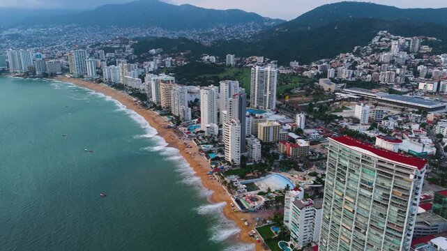 Golden hour drone footage of Acapulco Bay, Mexico