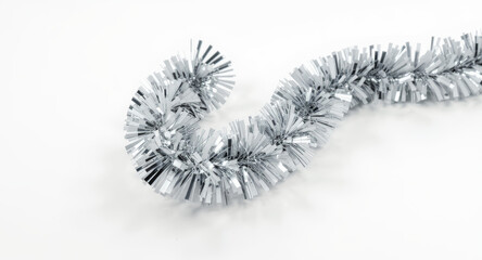 Sparkling silver tinsel garland adds festive flair and celebratory shimmer to any holiday or event decoration project