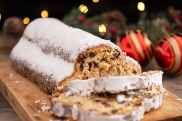 Traditional Christmas Stollen with Raisins on christmas background