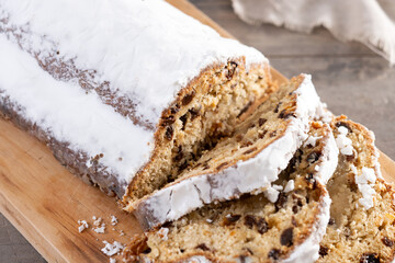 Traditional Christmas Stollen with Raisins on wooden table