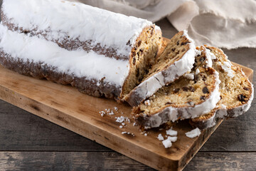 Traditional Christmas Stollen with Raisins on wooden table