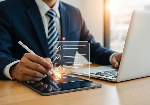 Businessman checking off items on a digital checklist on tablet