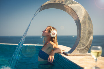 Woman relaxing at the pool