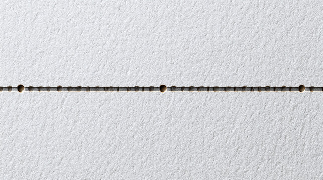 A straight, thin dotted line appears against a light surface, conveying a sense of order and precision. The line creates a subtle visual emphasis.