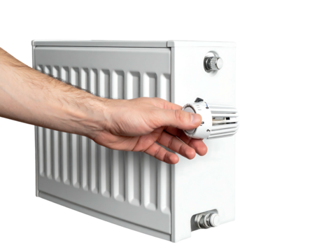 A person's hand turning the temperature control knob on a modern, white, panel radiator against a dark background