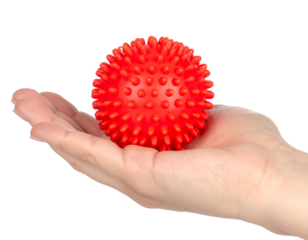 A red, spiky ball rests gently in the open palm of a hand, isolated on a solid black background. The ball is round and evenly covered in small bumps