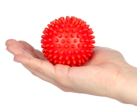 A red, spiky ball rests gently in the open palm of a hand, isolated on a solid black background. The ball is round and evenly covered in small bumps