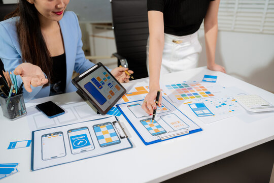 designer team coder or developer working using a computer display and smartphone in problem solving at workplace.